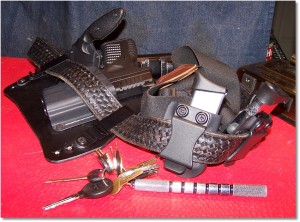 The EDC Rig, Springfield XDs 3.3 45, two spare magazine carriers by Cook's Holsters, 2 spare 5-round magazines with extensions, cell phone, Ka-Bar TDI LE knife, and Velcro-backed liner belt. And, yes, those are Perry suspenders.