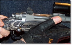 When lock-up is felt, the base of the thumb pushes the bolt handle downward to complete the lock up of the bolt and then moves forward to its support position on the forearm of the rifle.