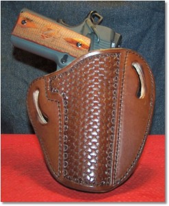 The Springfield 1911 Loaded in a OWB Holster by Leather Creek Holster of Gainesville, Georgia.  I used this holster in a recent training course and it is an excellent holster